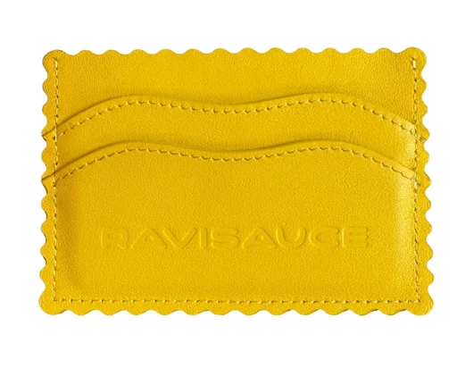 Yellow ravioli card holder with scalloped pasta edges, wavy card slots and an embossed RAVISAUCE logo on white